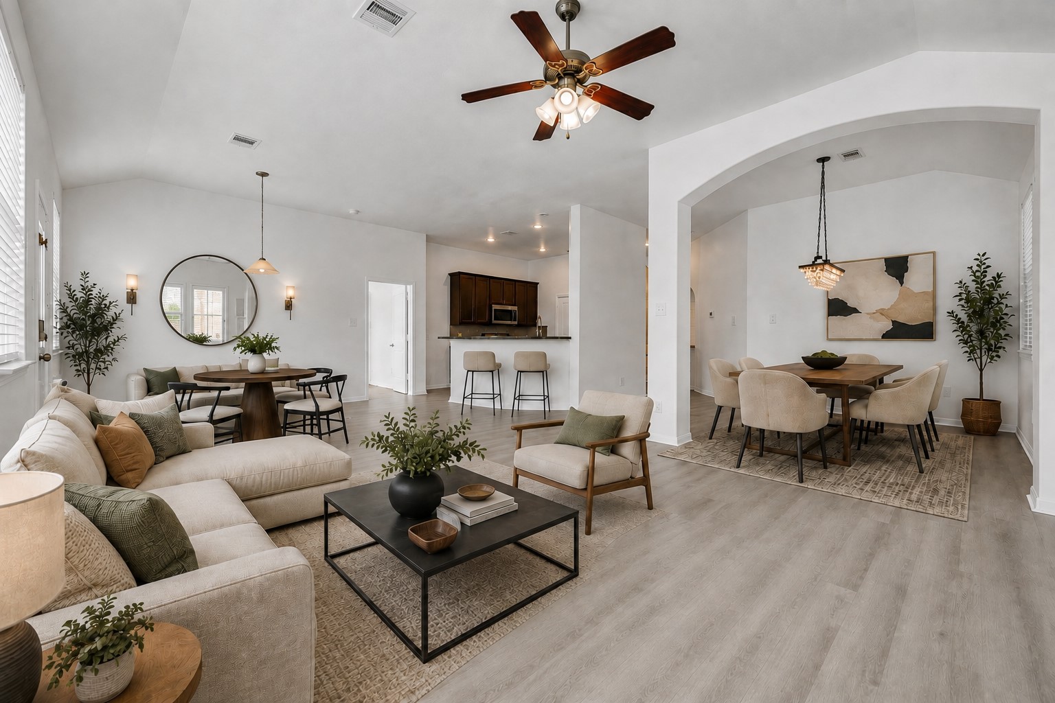 4707 Waukegan Road Conroe, TX 77306 - Photo 3 of 31 Step inside to a spacious open-concept layout where the living room, dining area, and kitchen flow seamlessly together, creating a comfortable setting for everyday living and entertaining. (Virtually Staged)