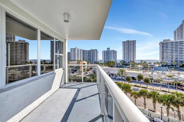 a view of swimming pool from a balcony