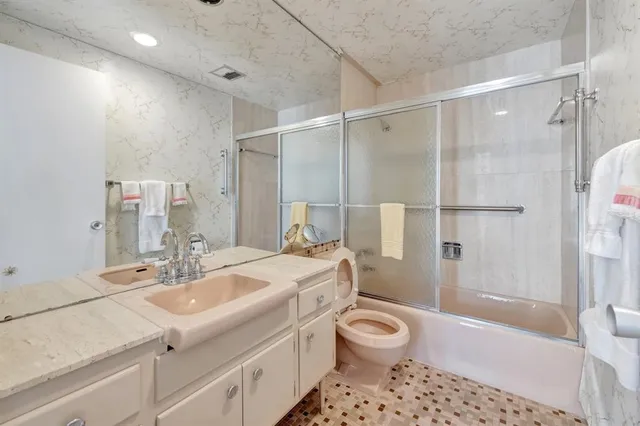 a view of a dining room with furniture and a large window