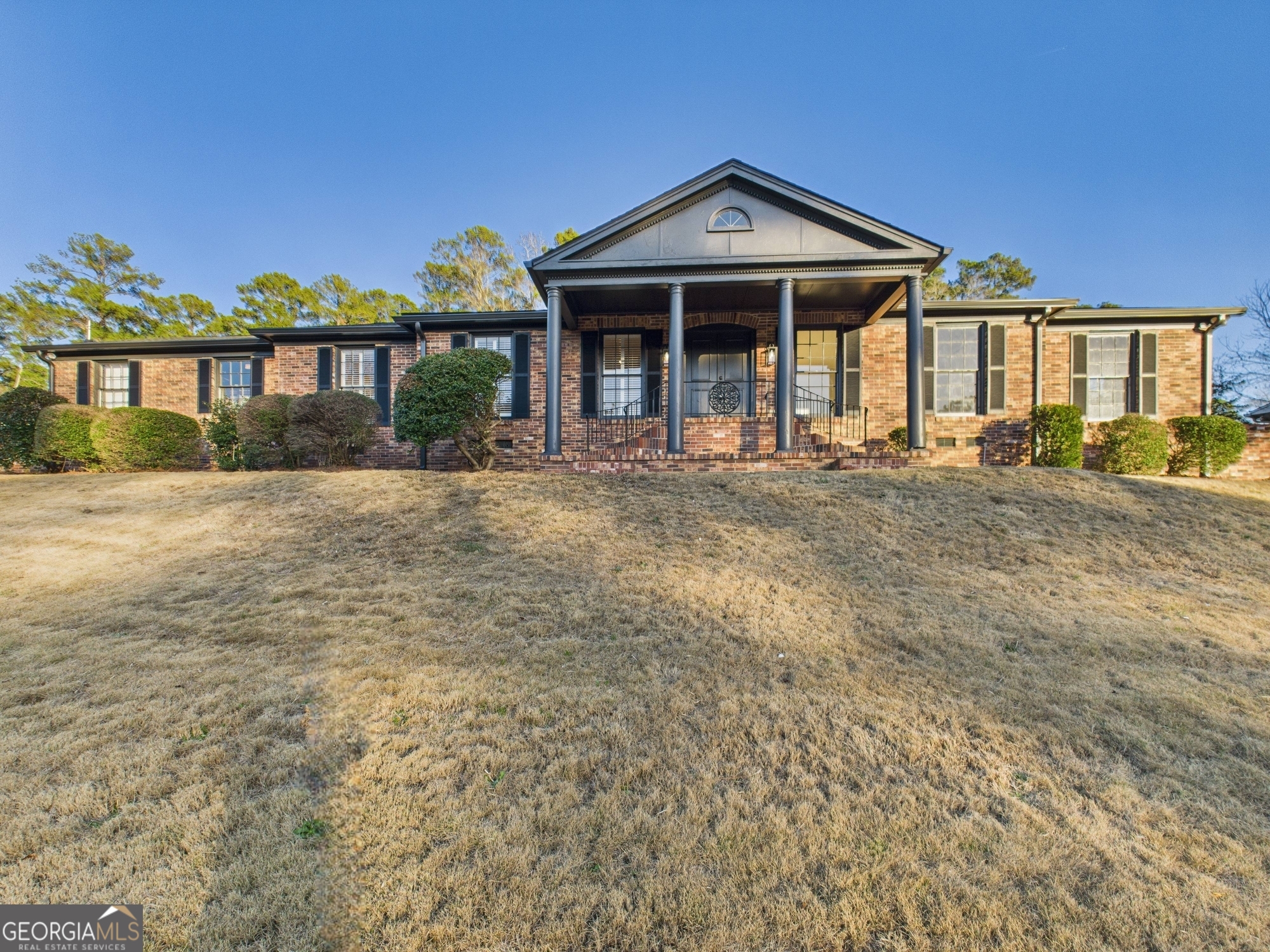 a front view of a house with a yard