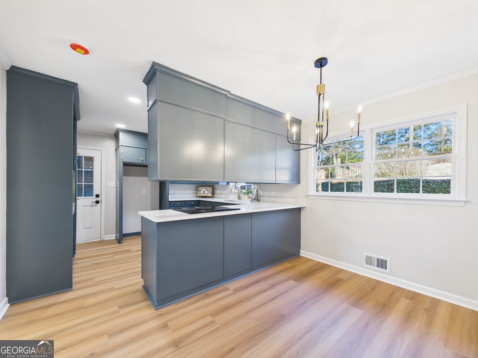 511 Pierce Avenue Macon, GA 31204 - Photo 13 of 57 a kitchen with stainless steel appliances granite countertop a sink a stove and a wooden floors
