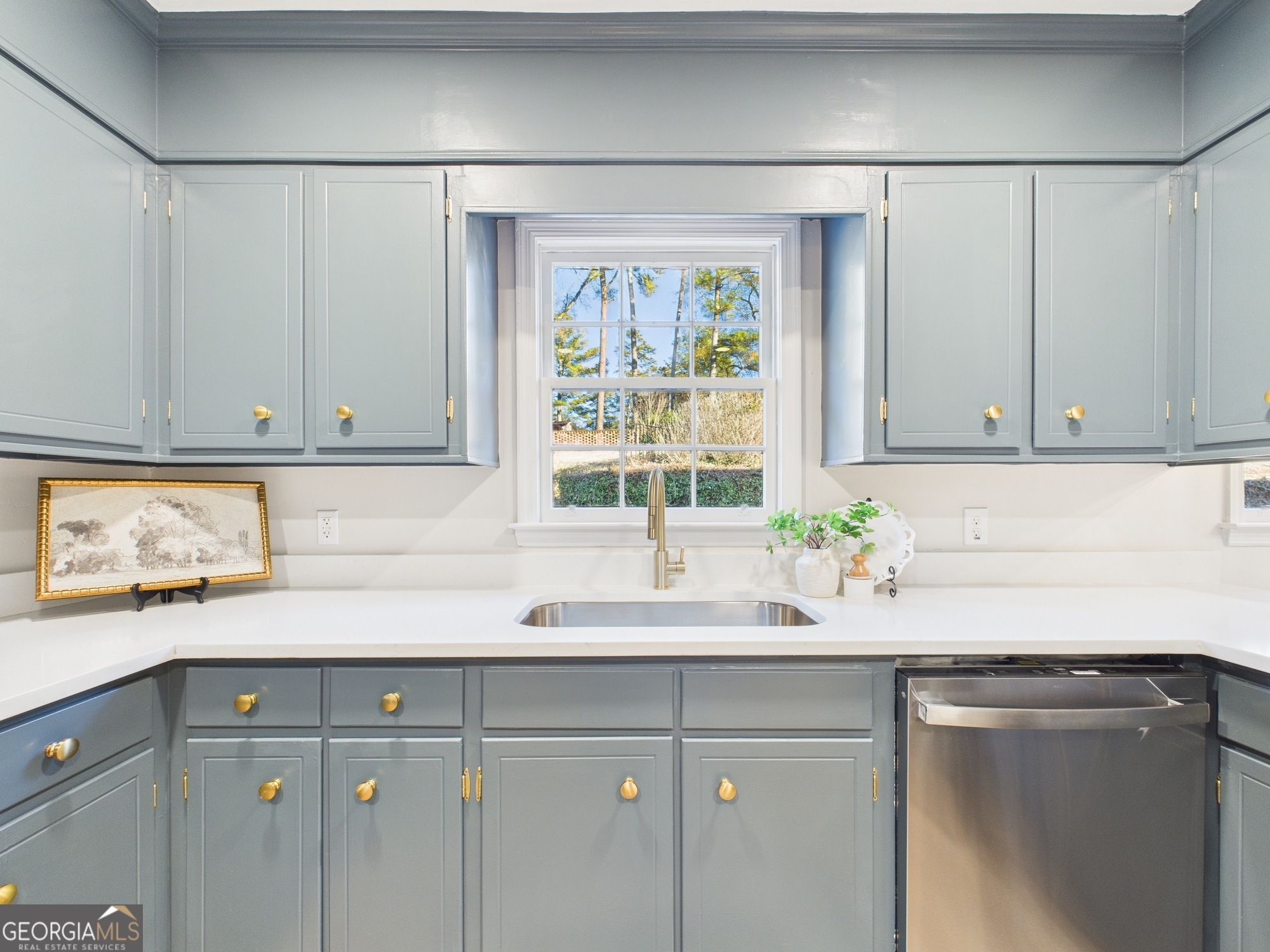 511 Pierce Avenue Macon, GA 31204 - Photo 17 of 57 a kitchen with a sink and cabinets