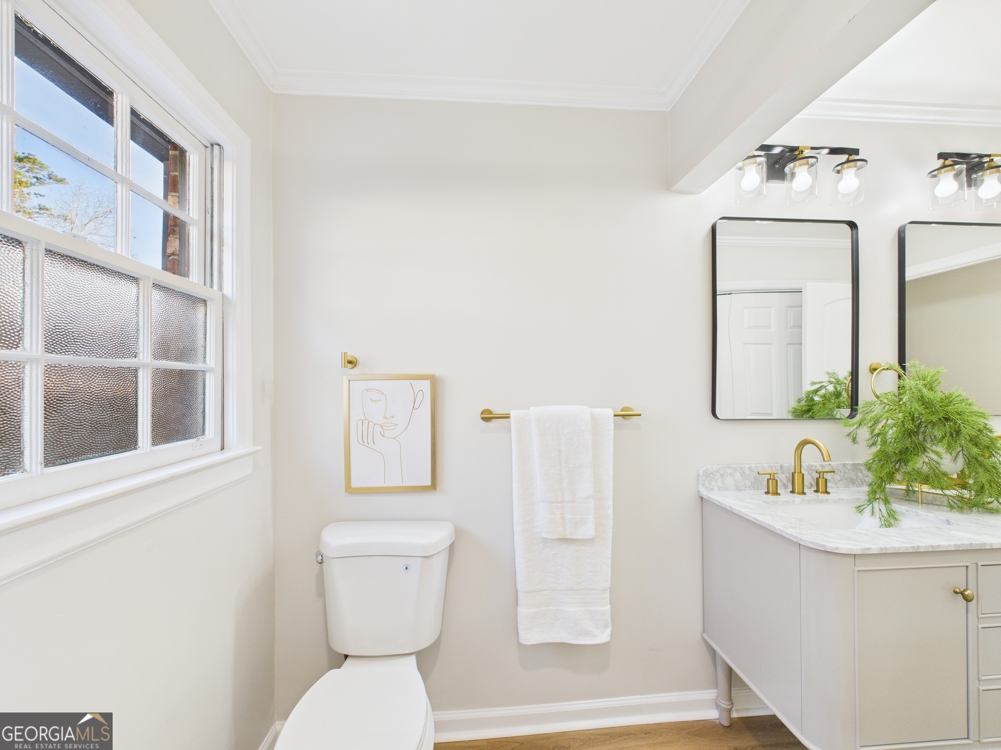 511 Pierce Avenue Macon, GA 31204 - Photo 38 of 57 a bathroom with a sink mirror and toilet
