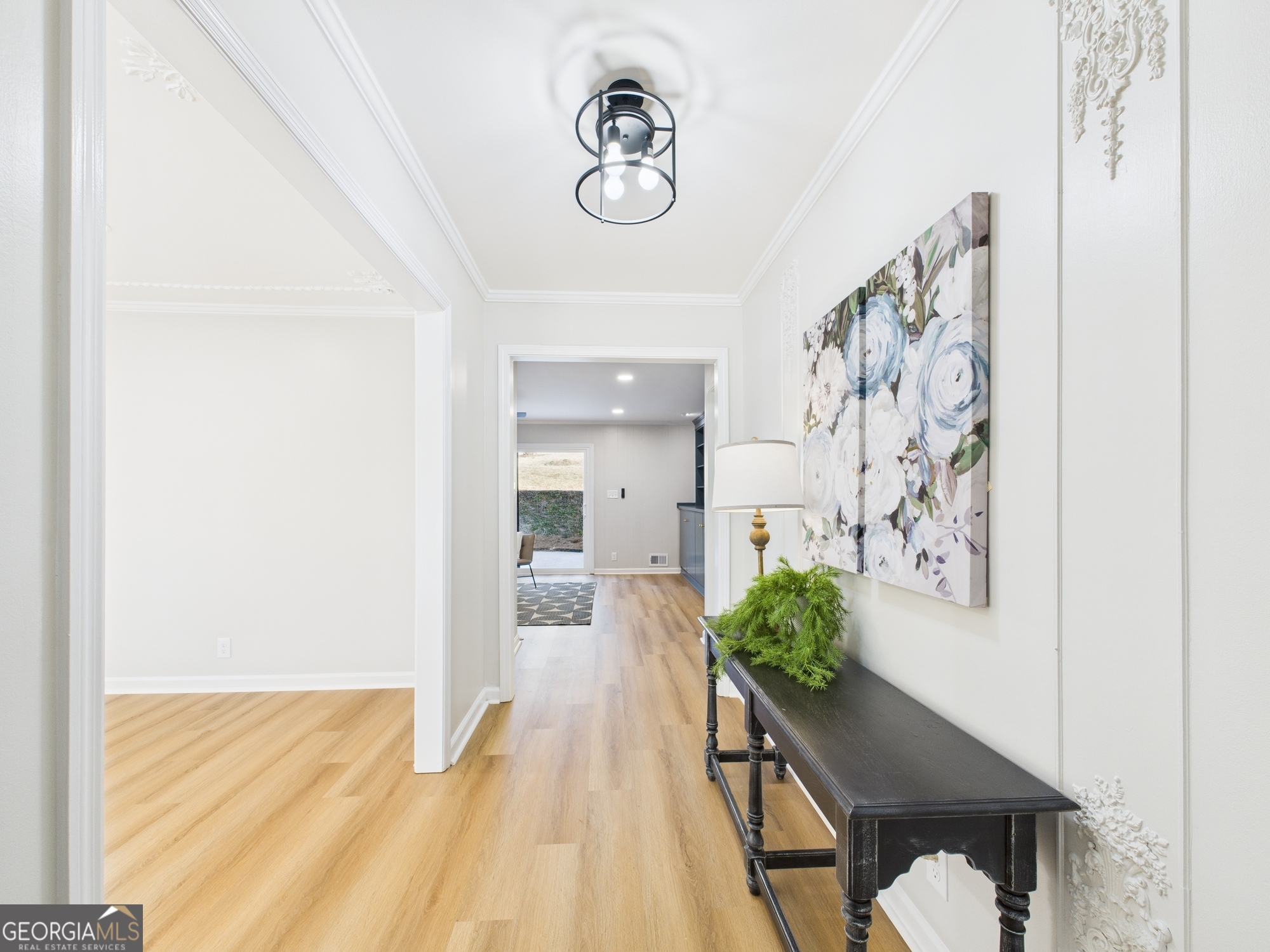 511 Pierce Avenue Macon, GA 31204 - Photo 4 of 57 a view of a hallway to a livingroom with furniture and wooden floor