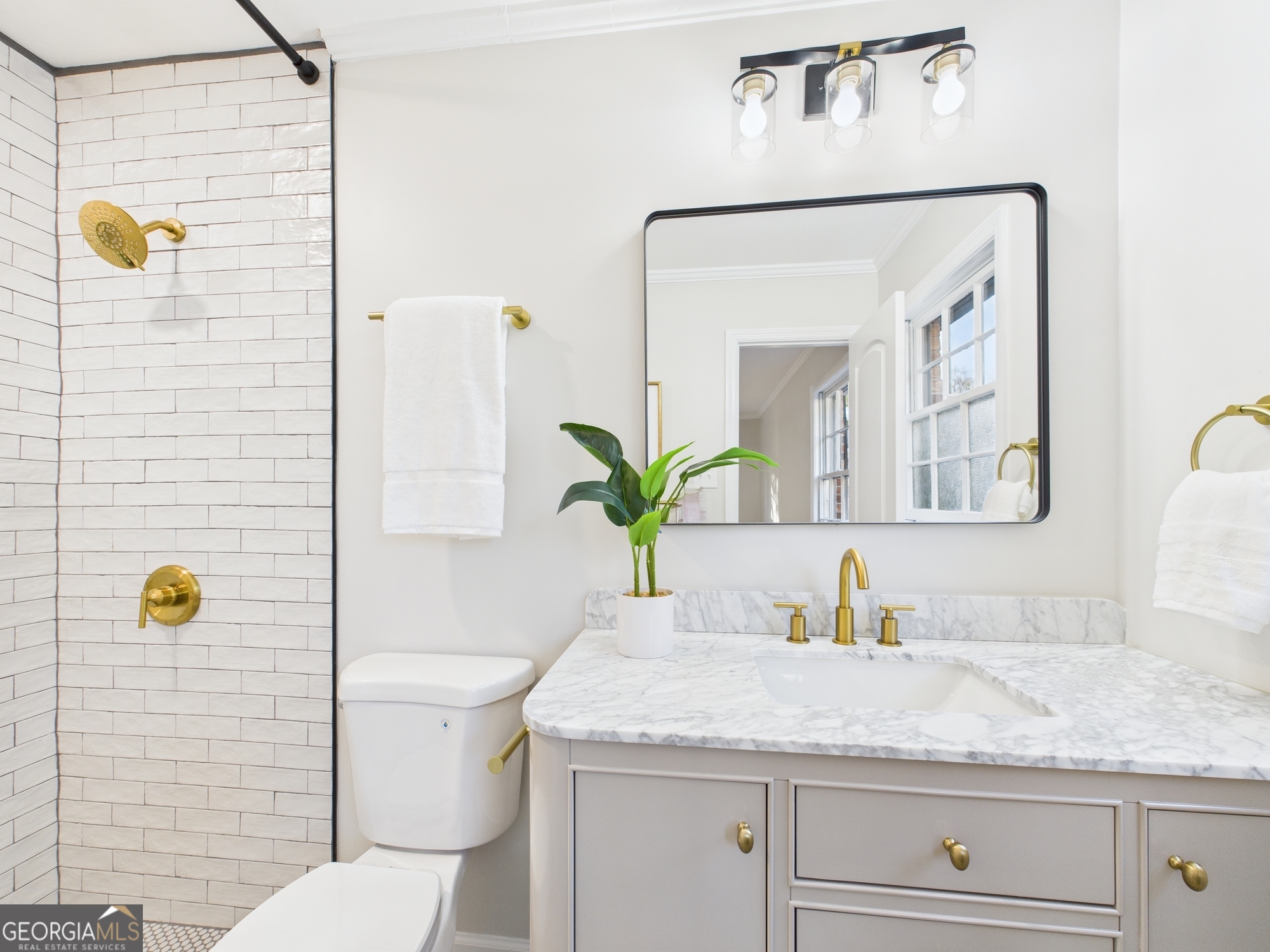 511 Pierce Avenue Macon, GA 31204 - Photo 46 of 57 a bathroom with a granite countertop sink a toilet and mirror