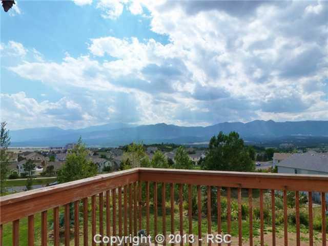12172 Stanley Canyon Road Colorado Springs, CO 80921 - Photo 10 of 25 Pikes peak and mountain views from deck of kitchen and greatroom