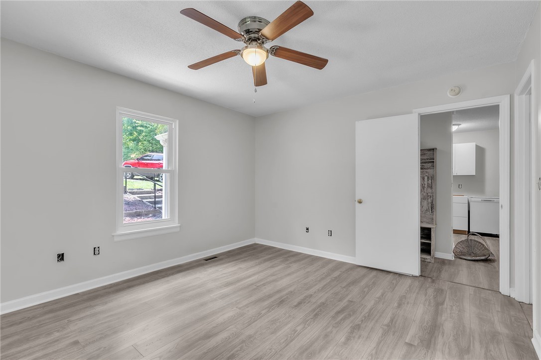 48 Tierra Drive Waterloo, SC 29384 - Photo 34 of 42 Smooth wood-look flooring and a bright window define this versatile interior space.