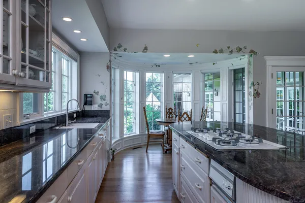 a kitchen with stainless steel appliances a sink and a refrigerator