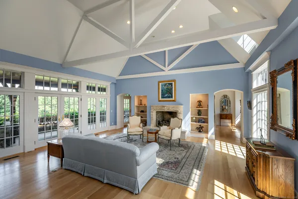 a living room with furniture and a fireplace