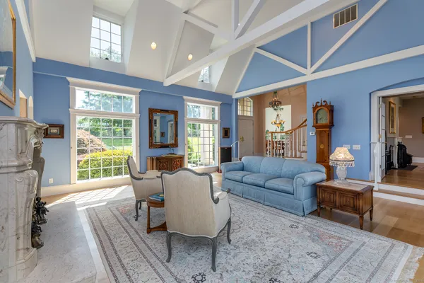 a dining room with furniture a rug and a chandelier