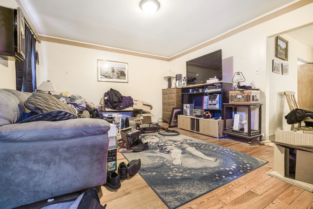 377 Hartwell Street Fall River, MA 02721 - Photo 13 of 31 a living room with furniture and a flat screen tv