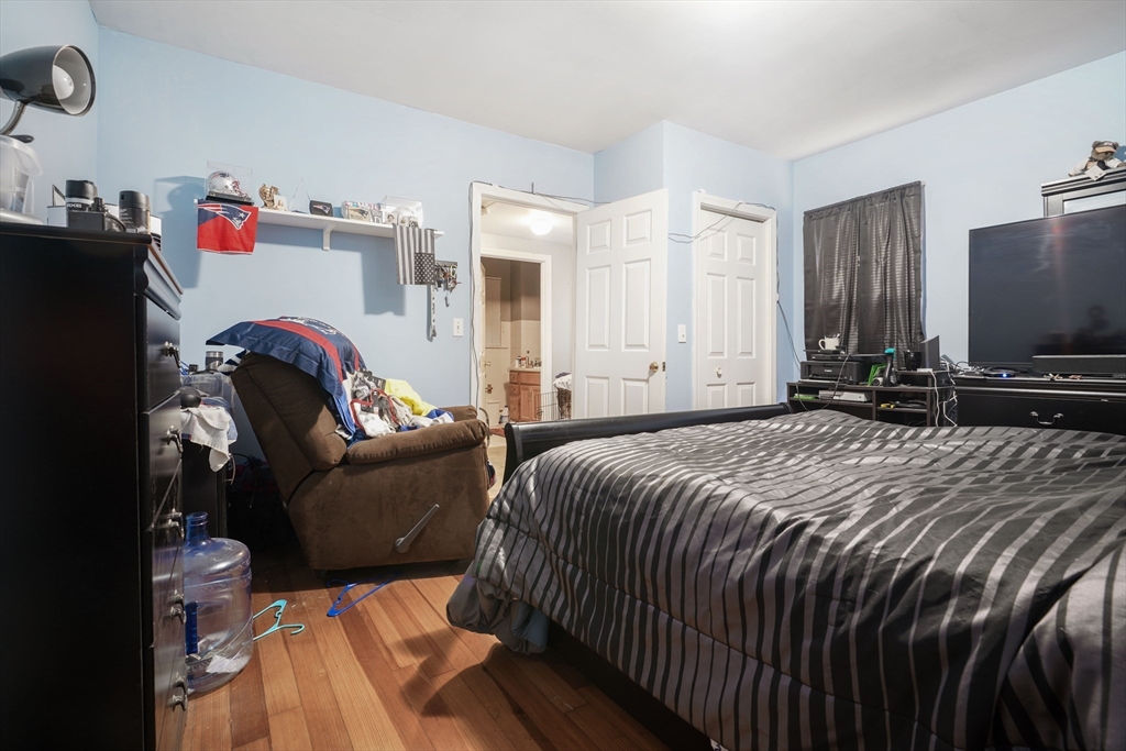 377 Hartwell Street Fall River, MA 02721 - Photo 18 of 31 a bedroom with a bed and flat screen tv