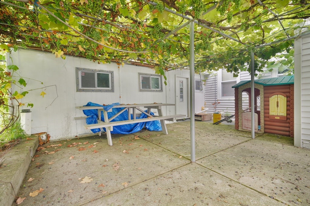377 Hartwell Street Fall River, MA 02721 - Photo 2 of 31 a view of a house with a backyard and a tree
