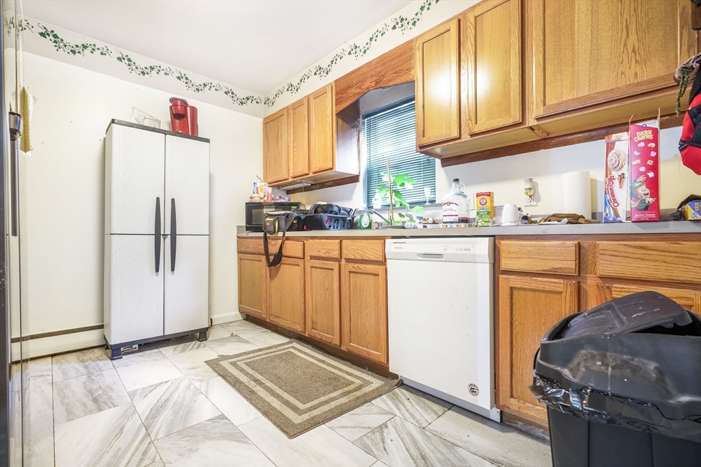 377 Hartwell Street Fall River, MA 02721 - Photo 21 of 31 a kitchen with stainless steel appliances granite countertop a refrigerator and a stove top oven