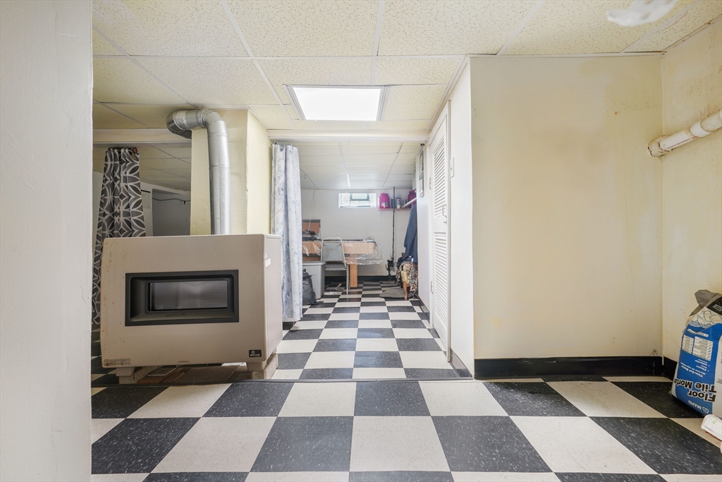 377 Hartwell Street Fall River, MA 02721 - Photo 23 of 31 a hallway with a black white checkered floor and a black white checkered floor
