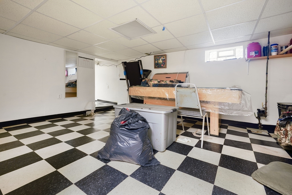 377 Hartwell Street Fall River, MA 02721 - Photo 24 of 31 a storage & utility room with a black white checkered floor