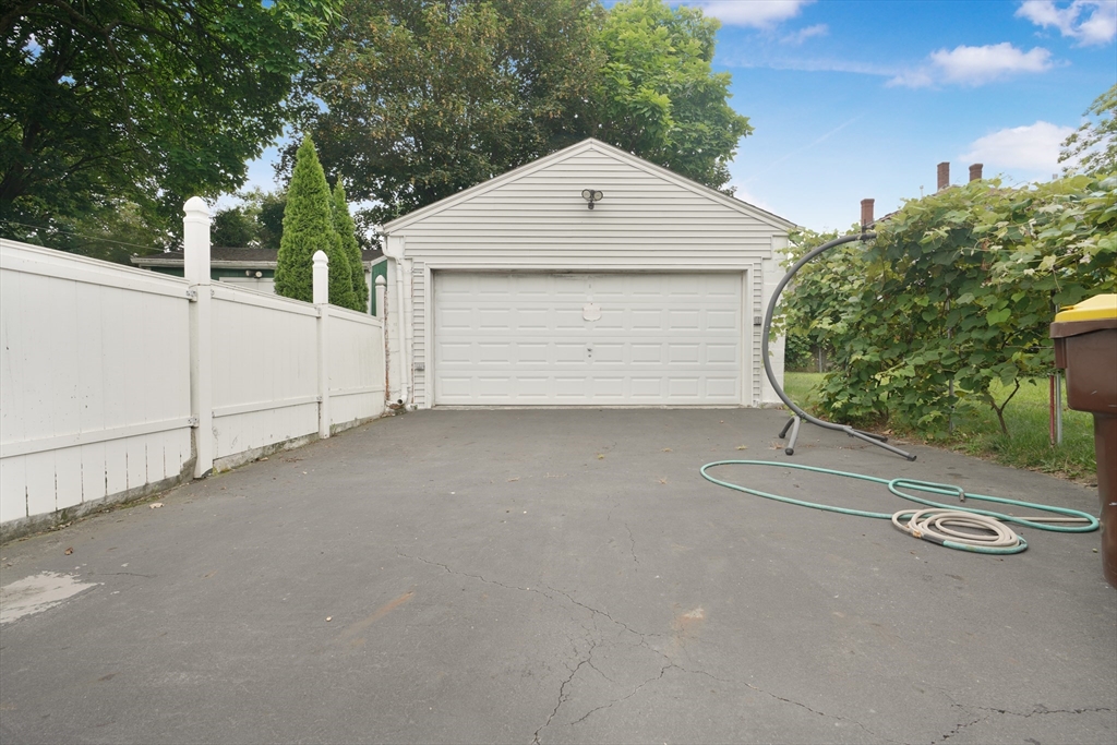 377 Hartwell Street Fall River, MA 02721 - Photo 29 of 31 a view of a house with a garage