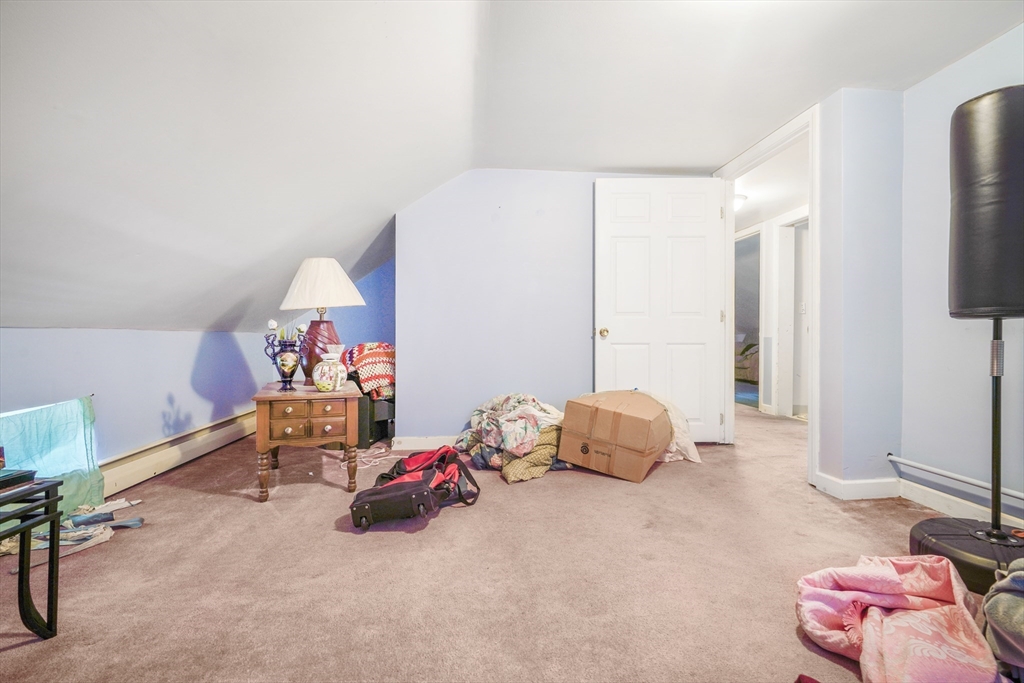 377 Hartwell Street Fall River, MA 02721 - Photo 5 of 31 a bedroom with furniture and a window