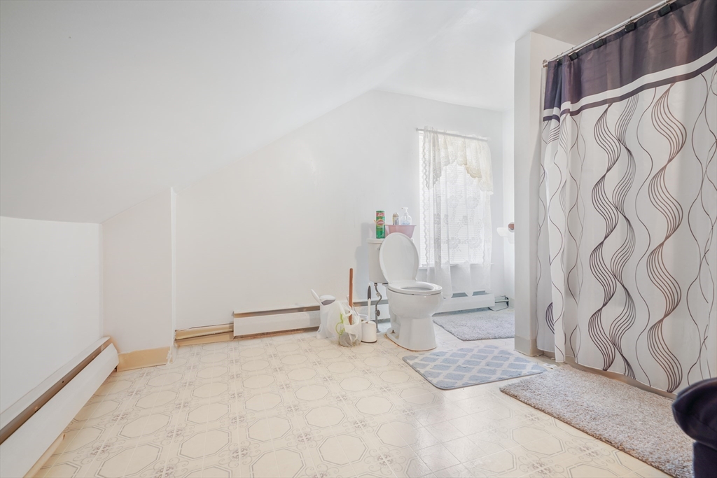 377 Hartwell Street Fall River, MA 02721 - Photo 6 of 31 a bathroom with a sink a toilet and shower