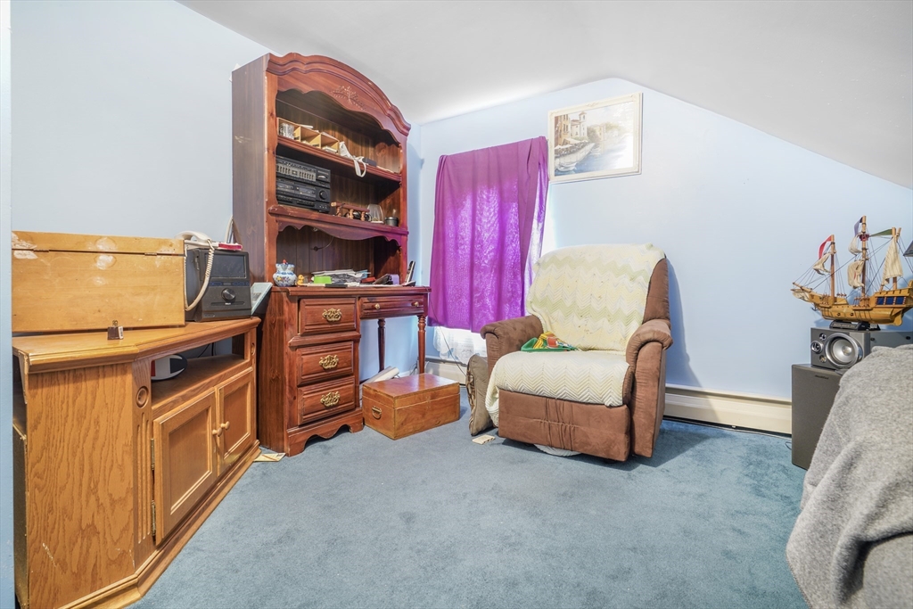 377 Hartwell Street Fall River, MA 02721 - Photo 9 of 31 a living room with furniture and a flat screen tv