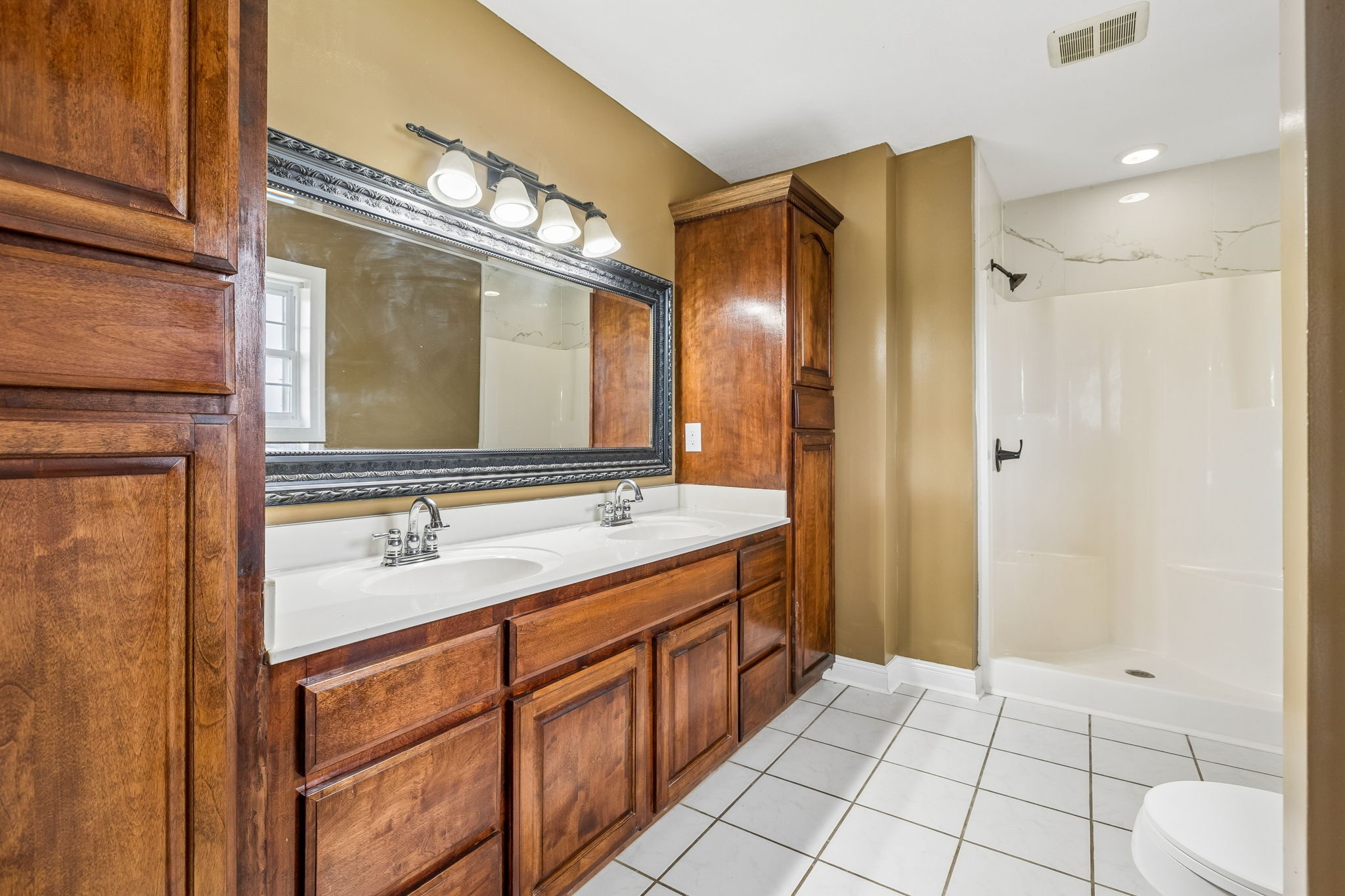 6701 McCormick Ridge Road Whitleyville, TN 38588 - Photo 30 of 63 a bathroom with a sink a mirror and a shower