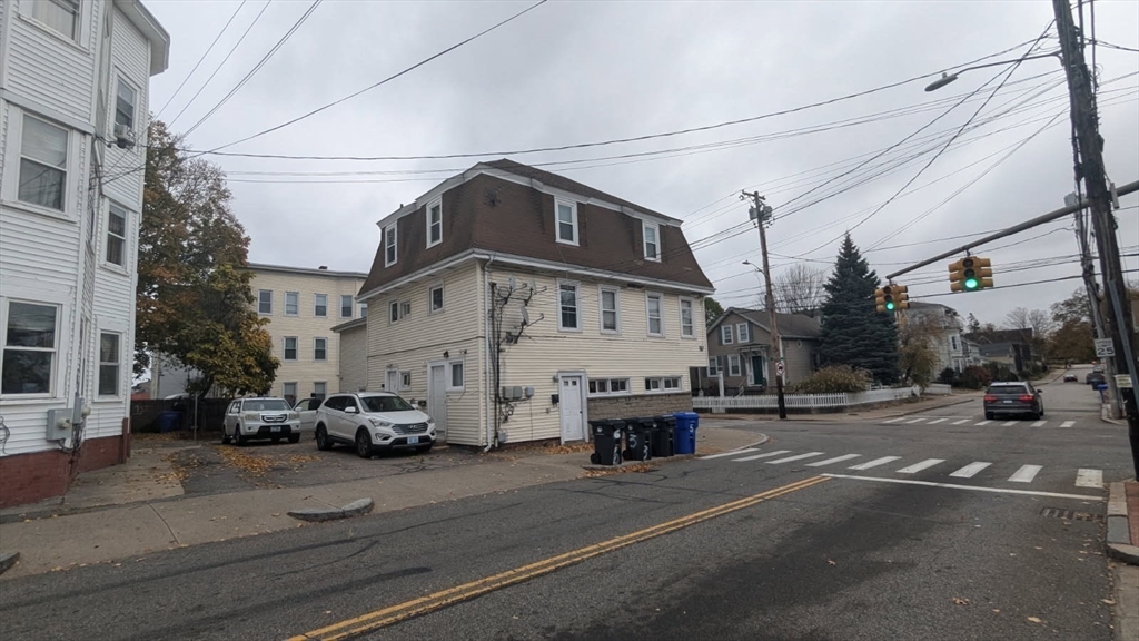 166 Division Street Pawtucket, RI 02860 - Photo 4 of 7 a view of a street with cars