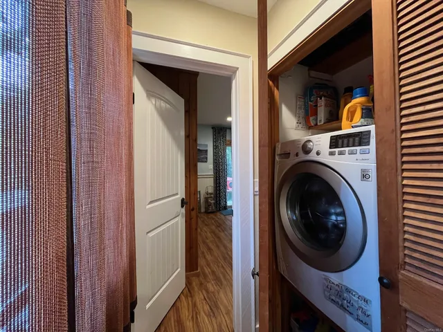 a view of a hallway with washer and dryer