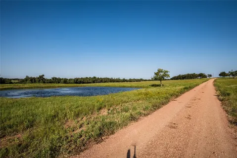 a view of a lake with houses in the background