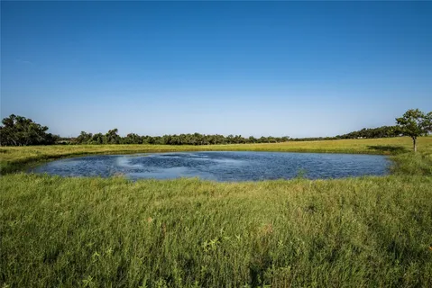 a view of a lake and a mountain in the background