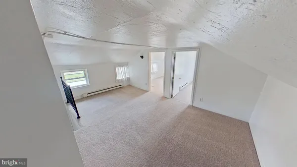 a view of empty room with windows