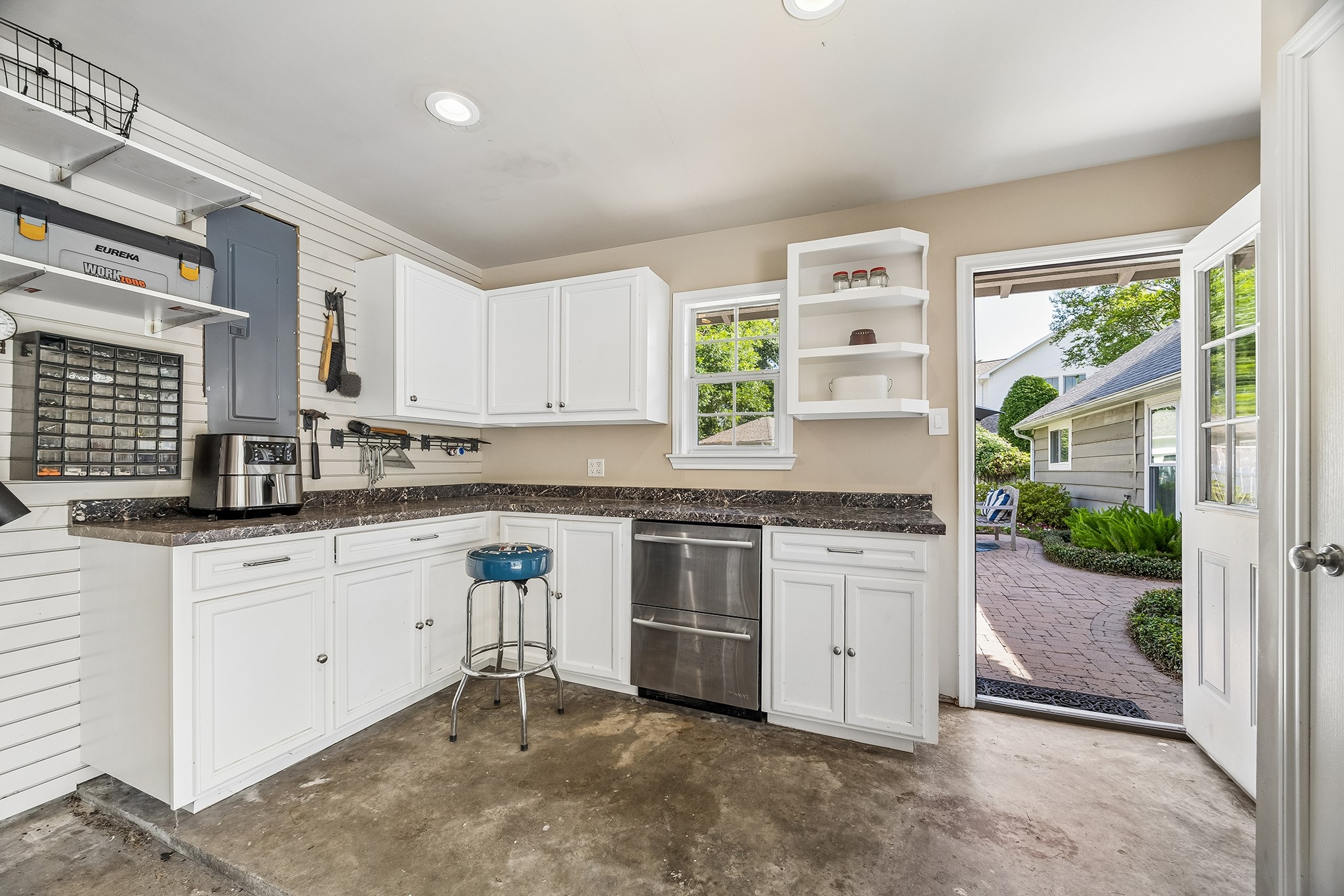 12615 Taylorcrest Road Houston, TX 77024 - Photo 26 of 29 This work space is in addition to the two car garage and serves as an additional prep space for pool parties. Complete with towel storage.