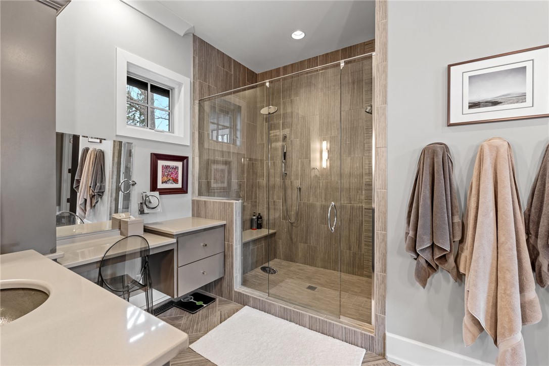 438 Winchester Lane Sunset, SC 29685 - Photo 15 of 47 This bathroom features a sleek vanity and a spacious glass-enclosed shower.