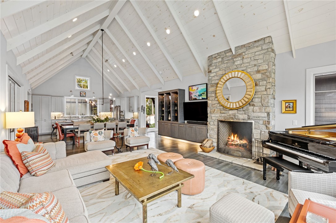 438 Winchester Lane Sunset, SC 29685 - Photo 6 of 49 This expansive great room features soaring vaulted ceilings, a cozy fireplace, and an open-concept kitchen.
