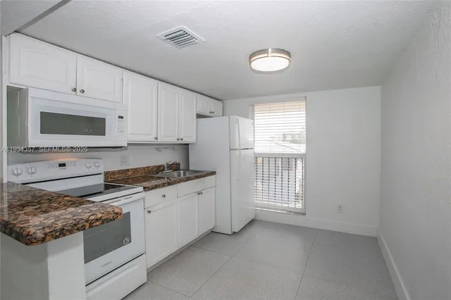 $220,000 | 241 South Royal Poinciana Boulevard, Unit 305, Miami Springs, FL 33166