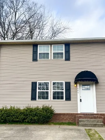 a front view of a house with garage