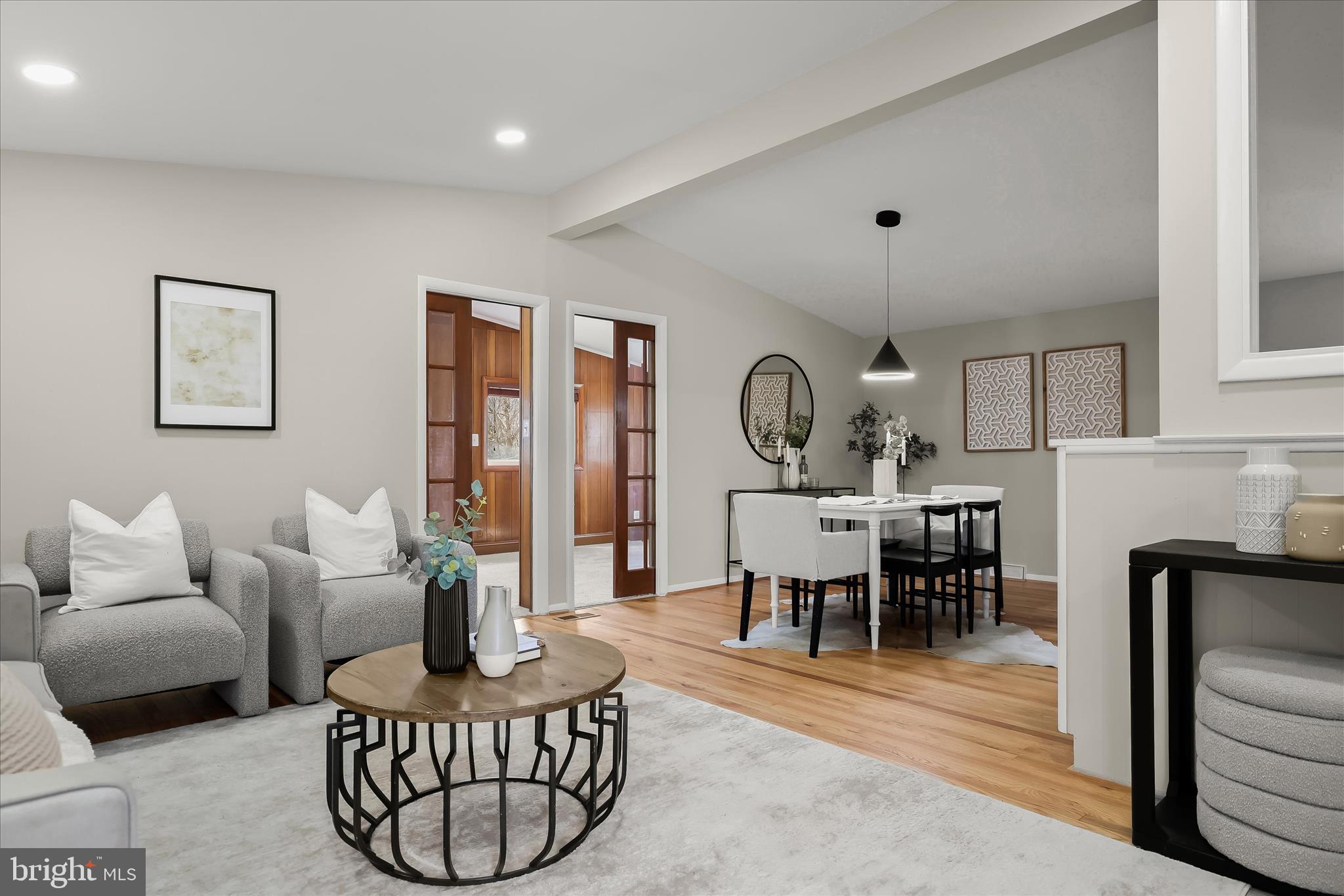 1009 Flagtree Lane Baltimore, MD 21208 - Photo 11 of 61 a living room with furniture a fireplace and a table