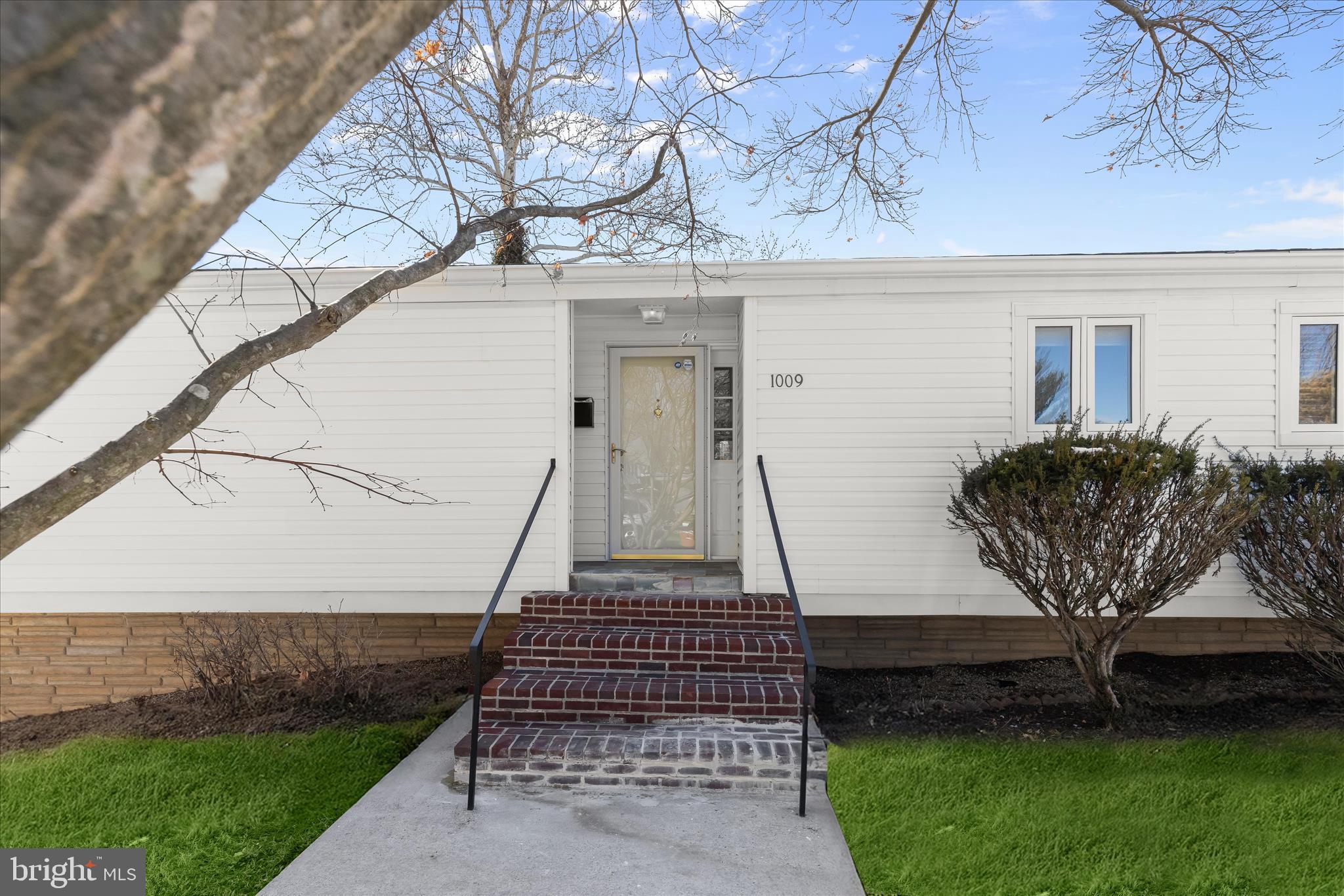 1009 Flagtree Lane Baltimore, MD 21208 - Photo 2 of 61 a front view of a house with garden