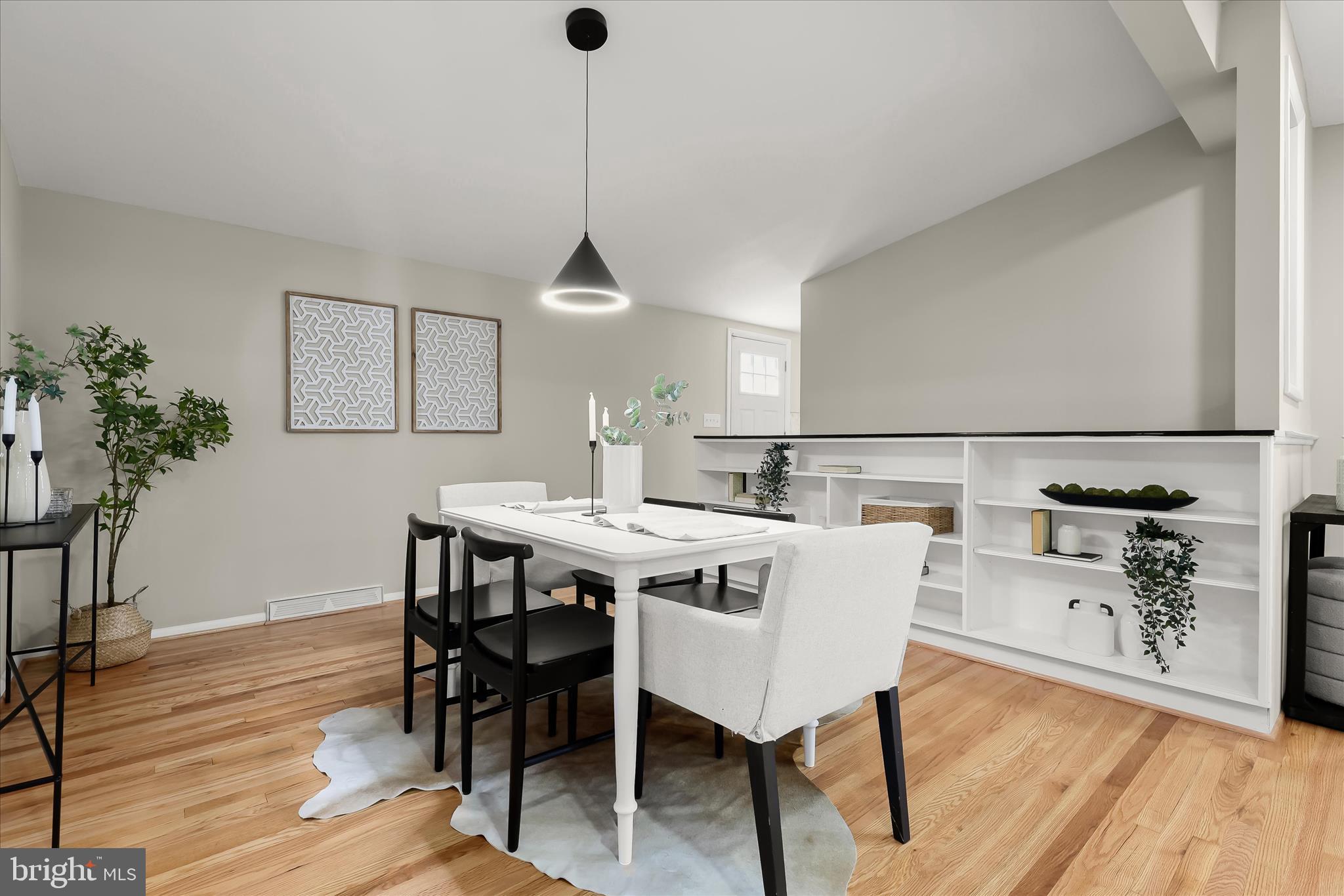 1009 Flagtree Lane Baltimore, MD 21208 - Photo 22 of 61 a view of a dining room with furniture and wooden floor