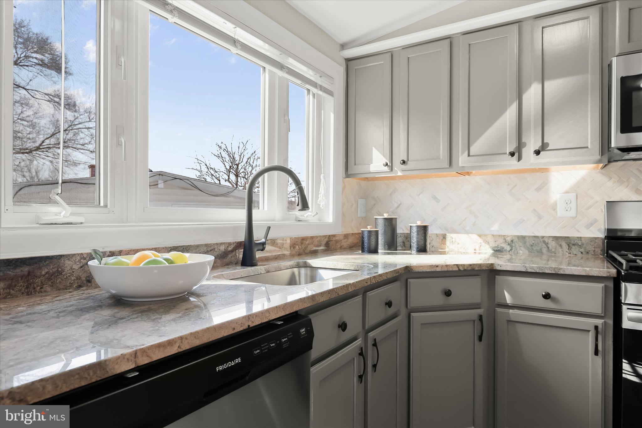 1009 Flagtree Lane Baltimore, MD 21208 - Photo 28 of 61 a kitchen with stainless steel appliances granite countertop a sink a stove and cabinets