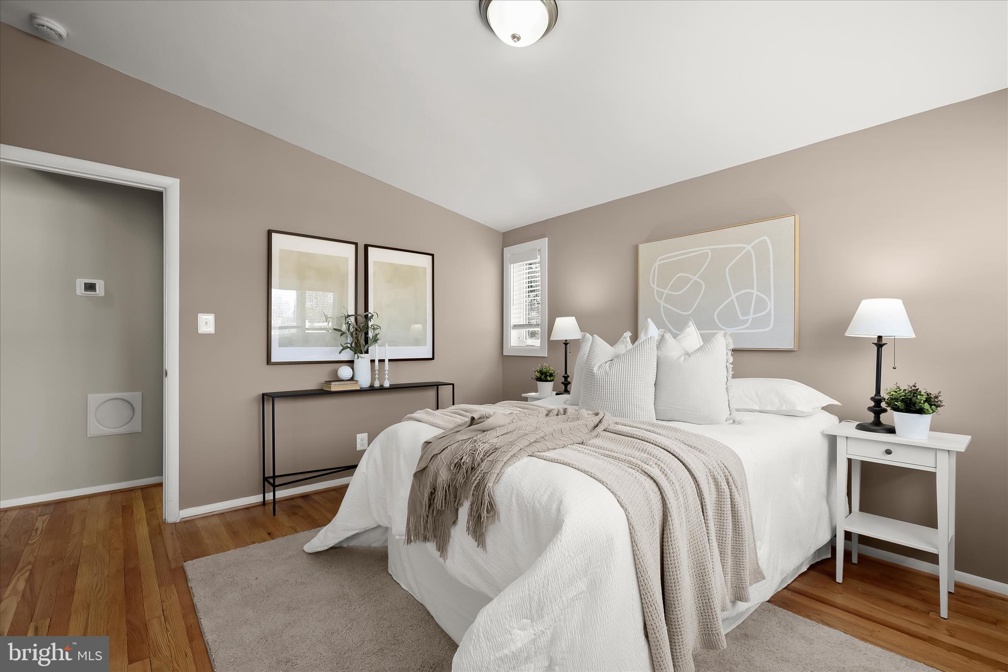 1009 Flagtree Lane Baltimore, MD 21208 - Photo 37 of 61 a bedroom with a bed and a lamp