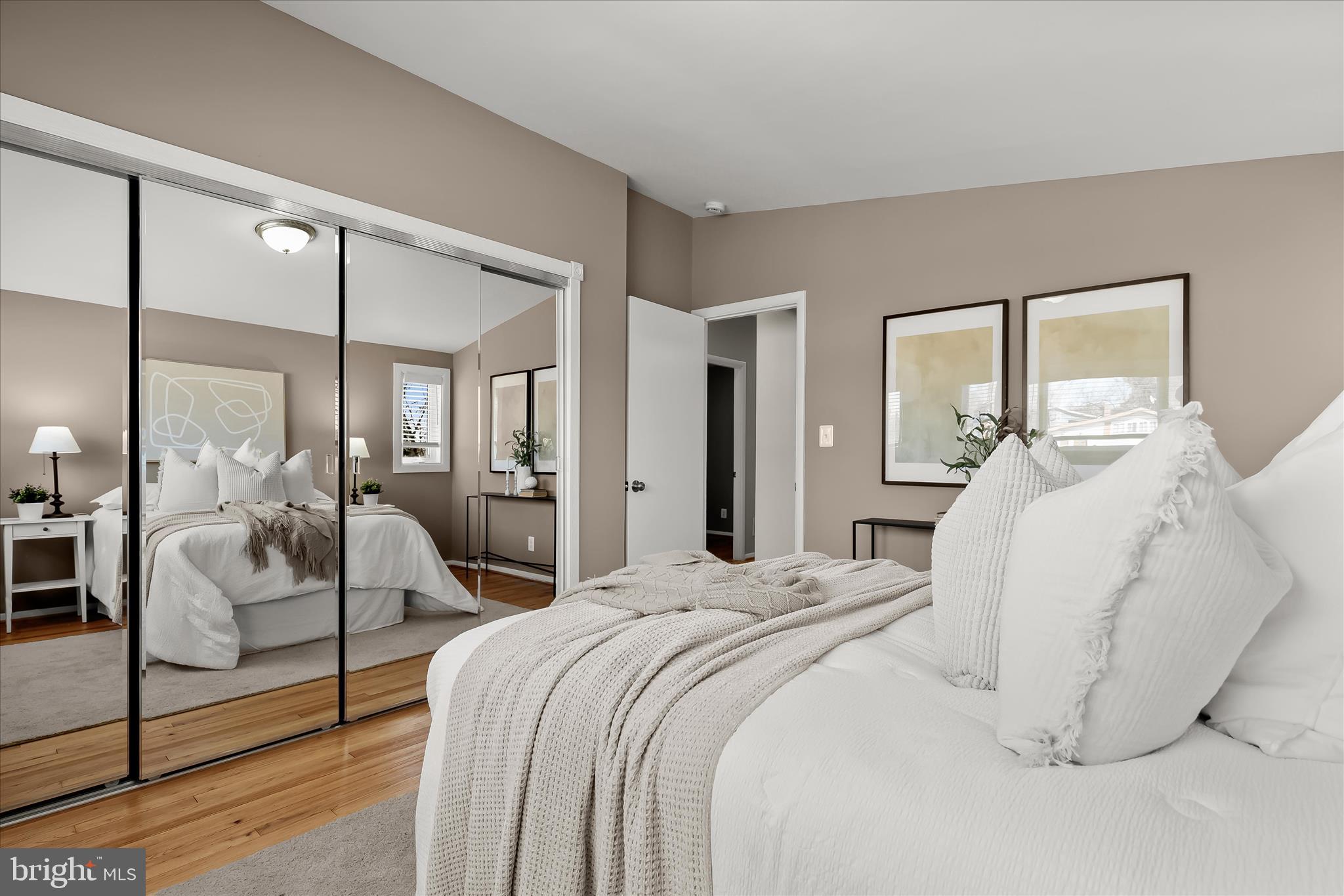 1009 Flagtree Lane Baltimore, MD 21208 - Photo 38 of 61 a bedroom with a bed and large mirror