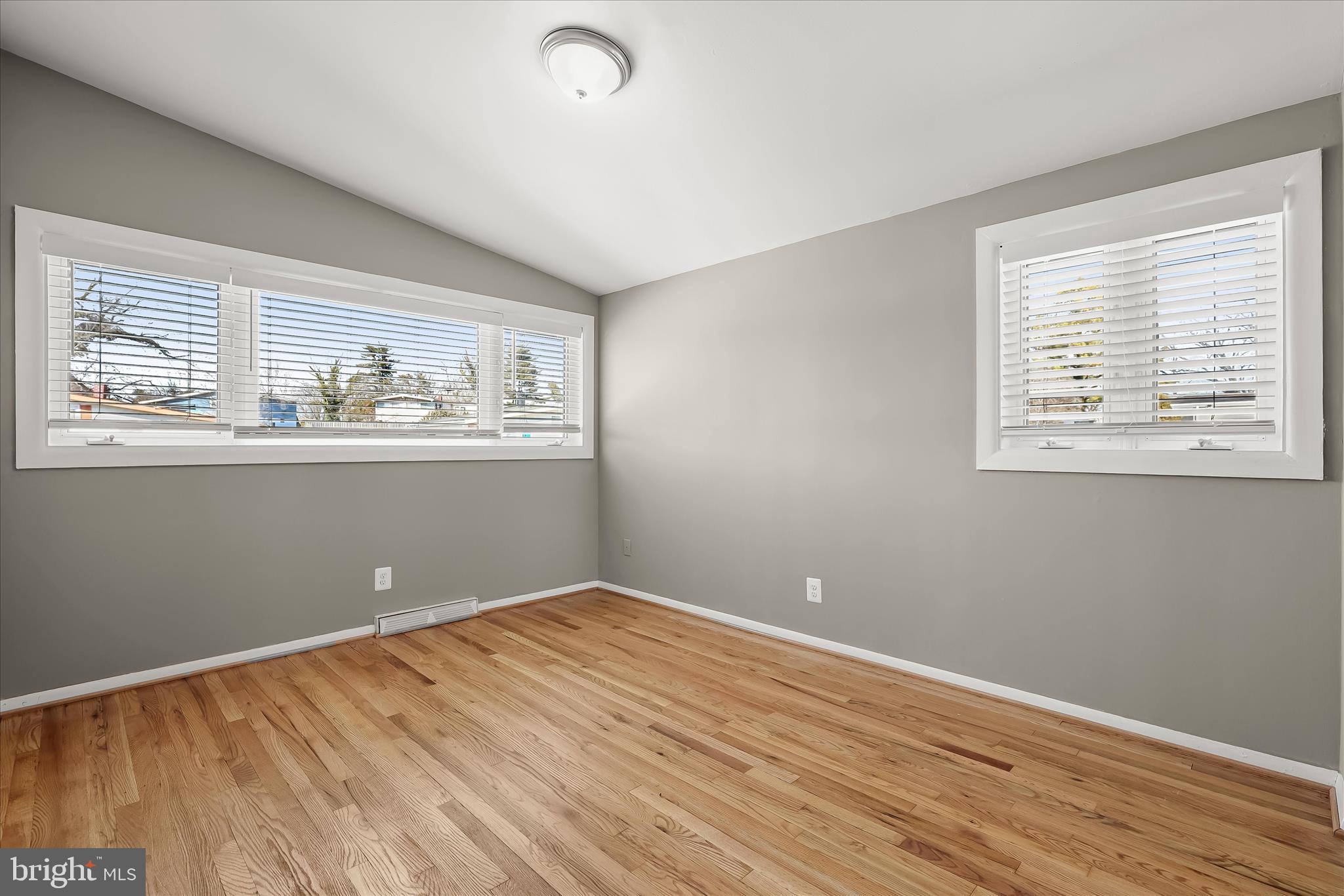 1009 Flagtree Lane Baltimore, MD 21208 - Photo 43 of 61 a view of empty room with wooden floor and fan