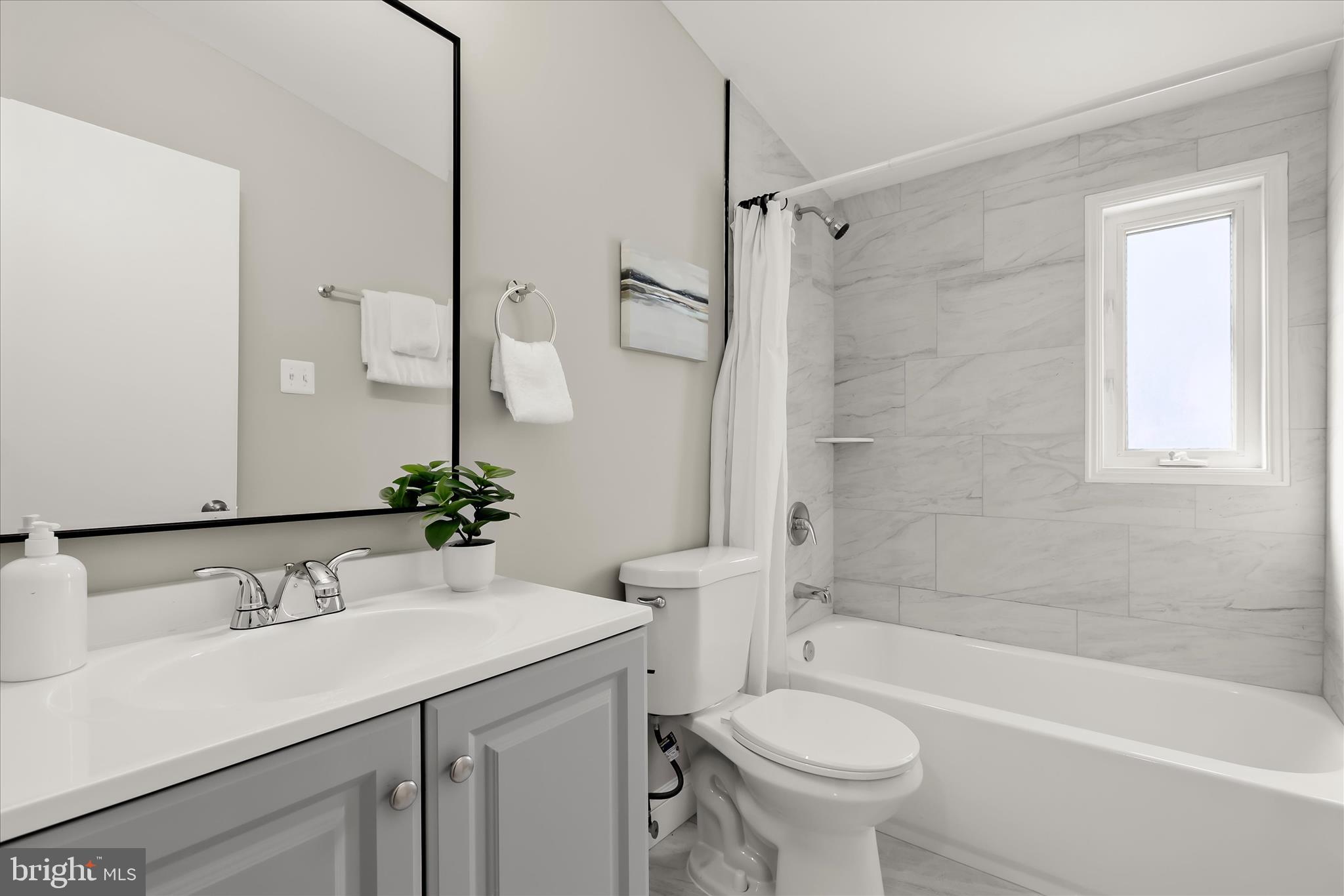 1009 Flagtree Lane Baltimore, MD 21208 - Photo 46 of 61 a bathroom with a sink toilet tub and shower