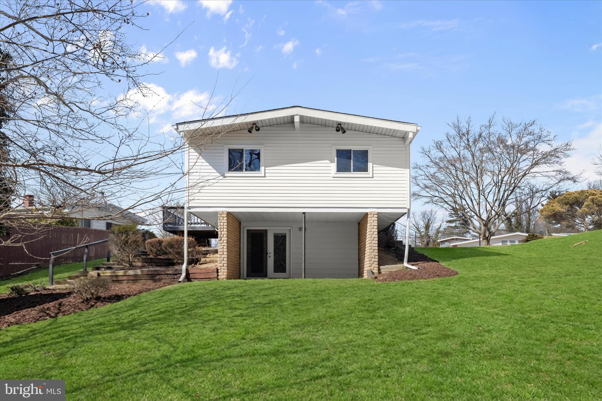 1009 Flagtree Lane Baltimore, MD 21208 - Photo 55 of 61 a front view of house with yard and green space