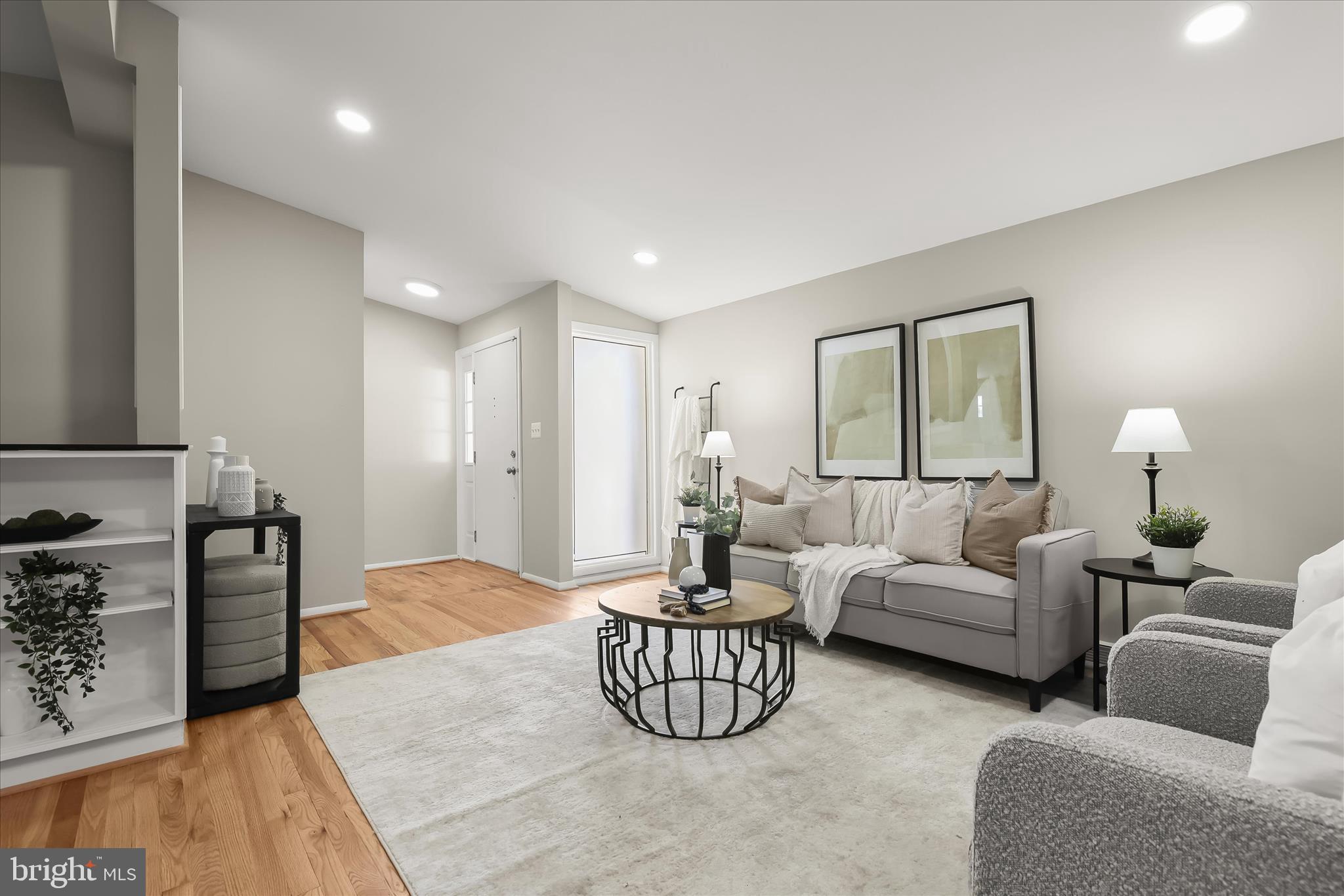 1009 Flagtree Lane Baltimore, MD 21208 - Photo 6 of 61 a living room with furniture a rug and a lamp