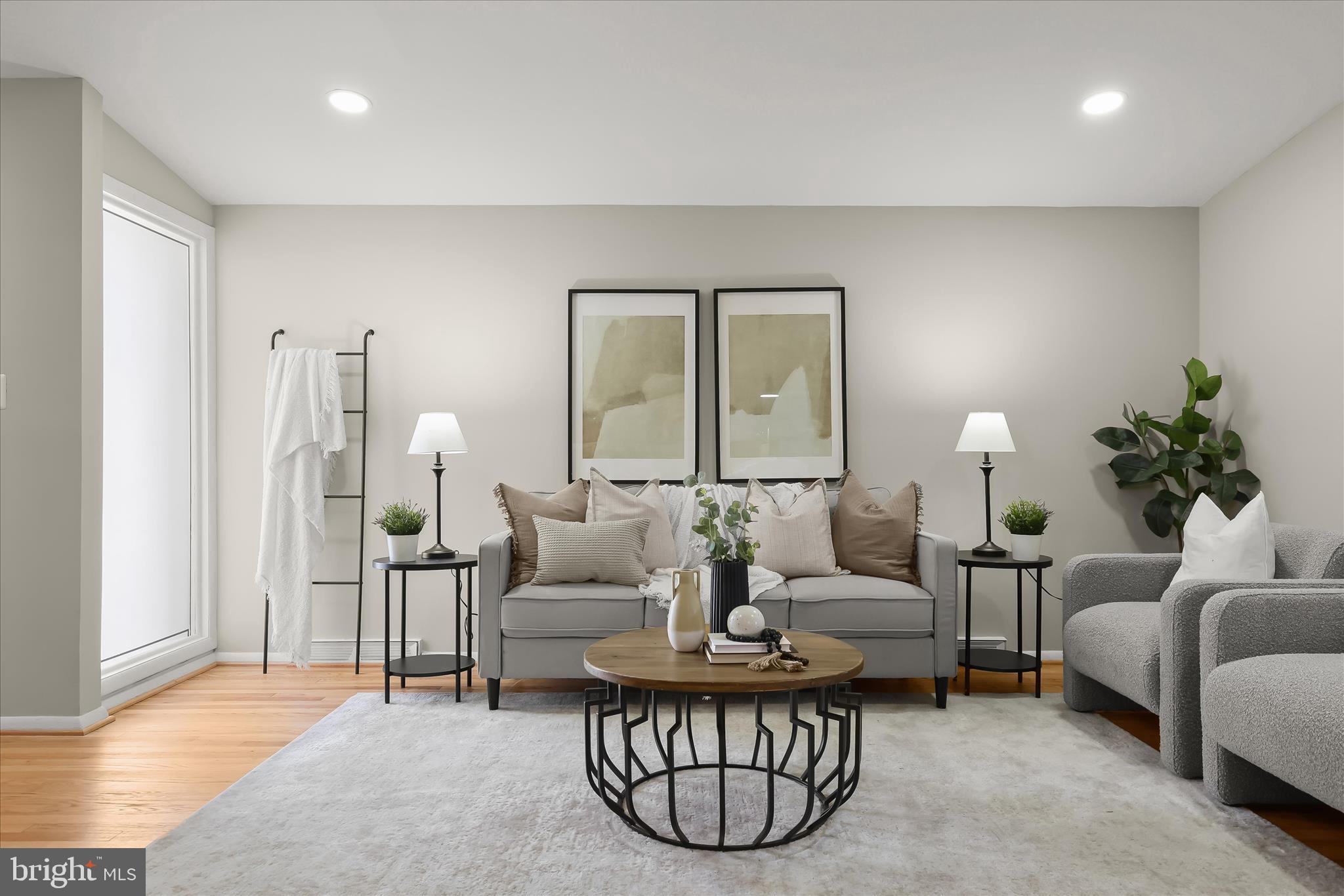 1009 Flagtree Lane Baltimore, MD 21208 - Photo 7 of 61 a living room with furniture and a lamp