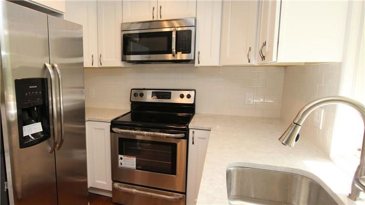 1 Mountain Laurel Road New Milford, CT 06776 - Photo 1 of 1 a kitchen with stainless steel appliances a stove a microwave and a sink