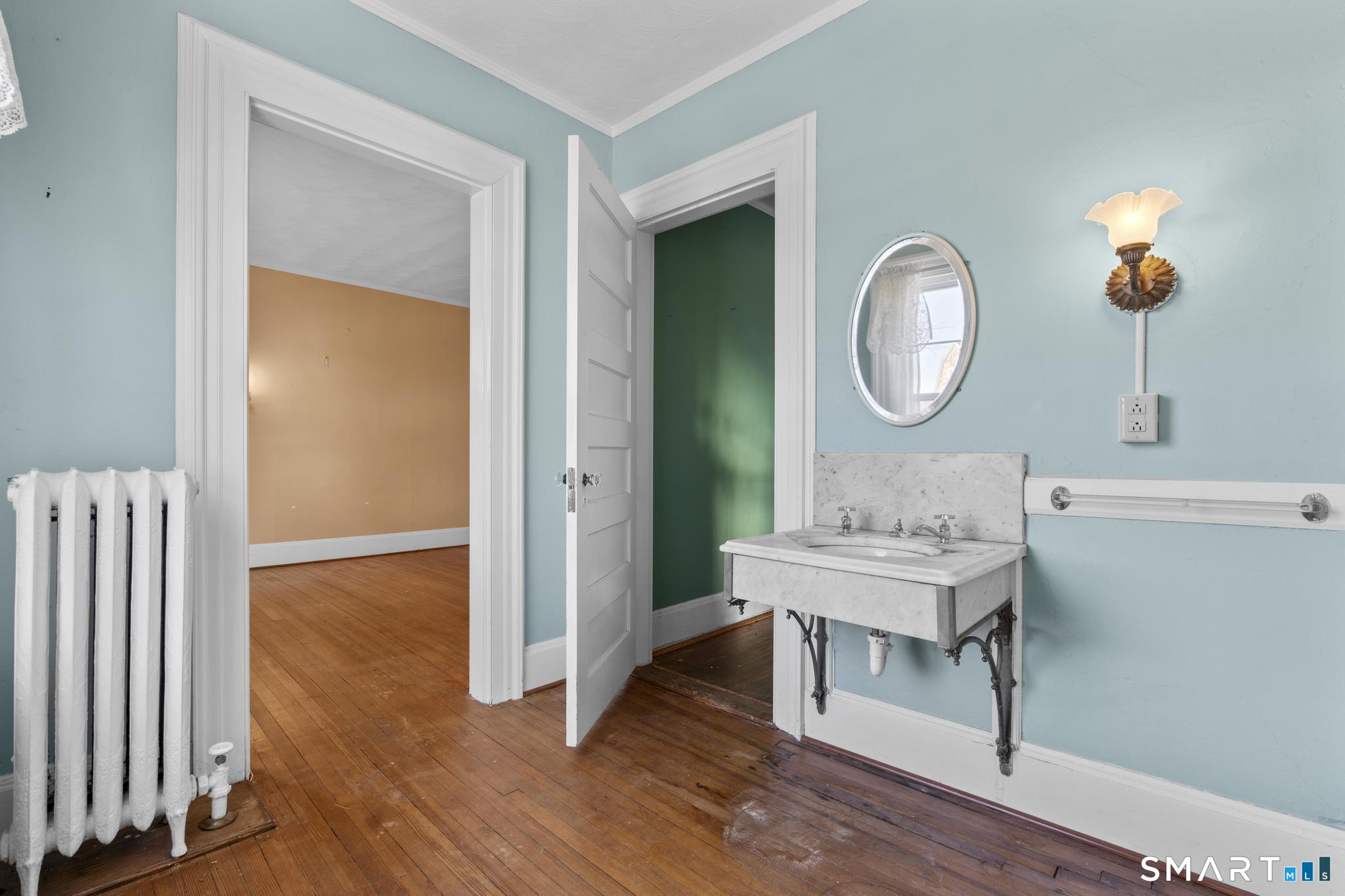 4 Fairview Terrace Derby, CT 06418 - Photo 11 of 34 a room with wooden floor and a mirror