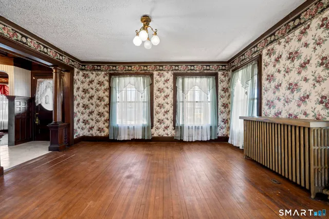 a view of an empty room with a balcony