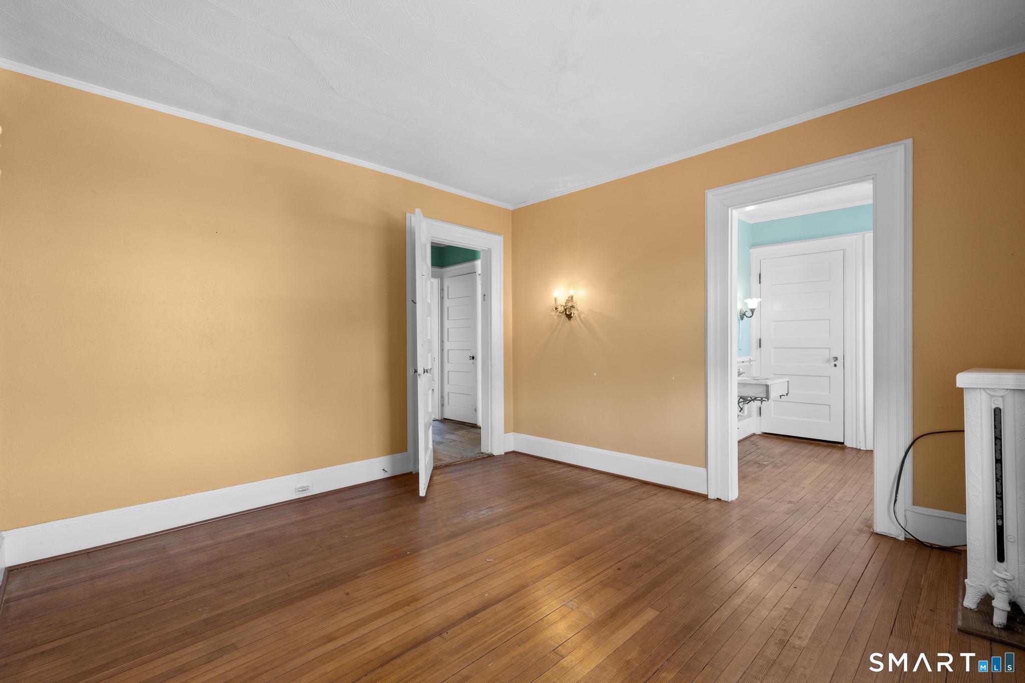 4 Fairview Terrace Derby, CT 06418 - Photo 12 of 34 an empty room with wooden floor and a window